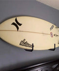 Surfboard mounted on wall using Heavy Duty 9 Inch Arm Wall Mount Storage Hooks Set With EVA Protector Indoor Outdoor Garage Hangers Organizer For Ladders Tools Bikes Hoses Gear And More 6 Pack.