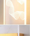 Close-up of Modern Acrylic Led Wall Sconce With Up And Down Ambient Glow Includes A Smart Remote For Swift Dimming and Cool White Switches.