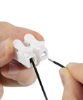 Close-up of Harness Disable Kit For Honda And Acura 3.5L V6 Engines To Disable VCM with white connector and black wire.