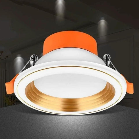 WKNHHL Recessed Lighting Housing Trim Kits Round Led Downlight Recessed Ultra Slim Chrome Aluminum Spotlight Commercial Clothing Mall Market Panel Ceiling Lights,White Ligh,Whit with orange trim and gold accents.