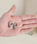 Premium Stainless Steel M4 Eye Bolts, Complete 24 Piece Hardware Set With Hex Nuts Flat And Spring Washers, shown in hand.