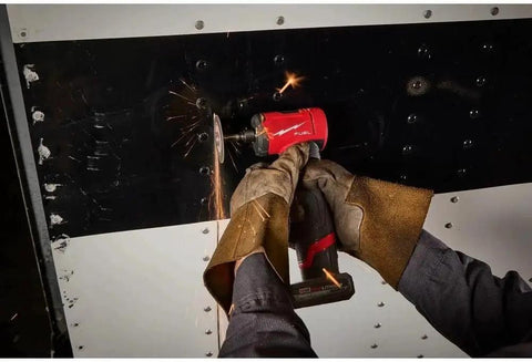 Person using Top Tier Quarter Inch Cordless Right Angle Die Grinder With Brushless Motor And Snappy Trigger for grinding metal.