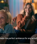 Child smiling with popcorn, enjoying cozy lighting created by Solid Smart Z Wave Plus Dimmer Switch That Plays Well With Alexa And All Your Mainstream Smart Hubs Classic Decora Build 600 Watt Adjustable Lighting Control Needs A Neutral Wire Comes In Ivory White Or Light Almond Single Pack.