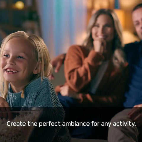 Child smiling with popcorn, enjoying cozy lighting created by Solid Smart Z Wave Plus Dimmer Switch That Plays Well With Alexa And All Your Mainstream Smart Hubs Classic Decora Build 600 Watt Adjustable Lighting Control Needs A Neutral Wire Comes In Ivory White Or Light Almond Single Pack.