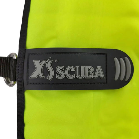 Close-up of XS Scuba logo on an Orange 50 Pound Lift Bag For Scuba Diving And Salvage, featuring durable nylon construction.
