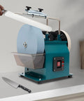 Badass 10 Inch Water Cooled Knife Sharpening Machine 240W Electric Bench Grinder featuring a knife being sharpened on its wheel.
