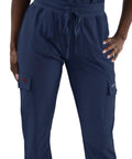 Women's Slim Fit Jogger Scrub Pants With Elastic Yoga Waistband Nurse Medical Uniform in navy blue with side pockets.