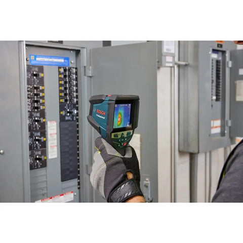 Person using 12V Max Connected Thermal Camera With 500 Sharp Thermal Images Storage For On Site Inspections in front of electrical panel
