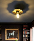 Vintage Metal Ceiling Light Fixture With Brass Finish, Split Flower Design, illuminating a cozy living room with retro vibe