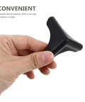 Hand holding silicone corner protector from Silicone Corner Protectors 4 Pack For Kitchen Tables And Furniture Edges Edge Guards