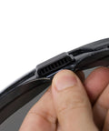Close-up of finger adjusting strap on Anti Fog Wide Vision Safety Goggles With ANSI Z87 Certification And UV Eye Protection.
