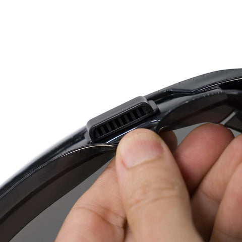 Close-up of finger adjusting strap on Anti Fog Wide Vision Safety Goggles With ANSI Z87 Certification And UV Eye Protection.