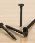 Pro Shop Heavy Duty Six By One And A Quarter Inch Drywall Screws With Easy Spin Phillips Drive Rock Solid Bugle Head Fasteners For Sheetrock Wallboard Jobs 200 Pack Black Phosphate Gear on wood surface.