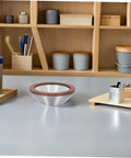 Pro Diamond Cup Grinding Wheel 100mm Silver Concave Bowl that Cuts Like Hell, displayed on a workshop table.