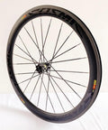 Carbon Fiber 700C Road Bike Wheel Set With 50mm Clincher Rim, in a side angle showing disc brake compatibility and DT Tooth 36T Hub.