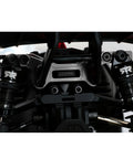 Detailed view of Beefed Up Extended Aluminum Damper Plate Upgrade for Typhon Grom RC Car with black durable finish and alloy construction.