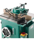 Built Like A Tank One Point Five Horsepower Woodworking Shaper Featuring Massive Twenty By Eighteen Inch Cast Iron Table And Dual Voltage Motor for precision wood cuts.