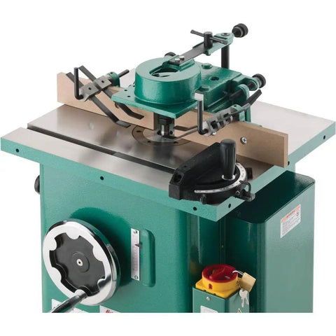 Built Like A Tank One Point Five Horsepower Woodworking Shaper Featuring Massive Twenty By Eighteen Inch Cast Iron Table And Dual Voltage Motor for precision wood cuts.