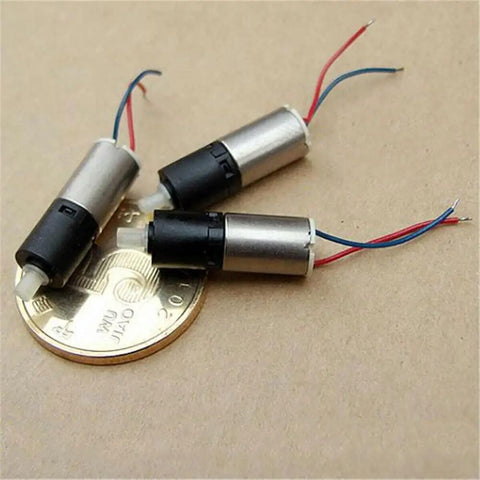 Ultra Tiny 6mm DC 3V Mini Planetary Gear Motor With 1 To 26 Gearbox 1200 RPM Coreless Drive, shown on a coin for scale.