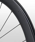 Close-up of the 105 WH-RS710 C46 Carbon Front Road Wheel Tubeless-Ready Dope Build, 46mm Rim, showing spoke detail and finish.