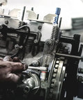 Mechanic using Zyklop 8790 HMA One Quarter Inch Socket With Hex Head Four Millimeter And Twenty Three Millimeter Length Knurled Grip