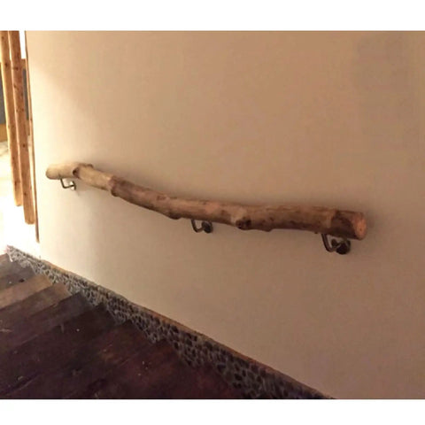 Built Like A Tank Adjustable Solid Wood Handrail Kit Tough Metal Brackets Nonslip Stair Railing on wall in indoor staircase.