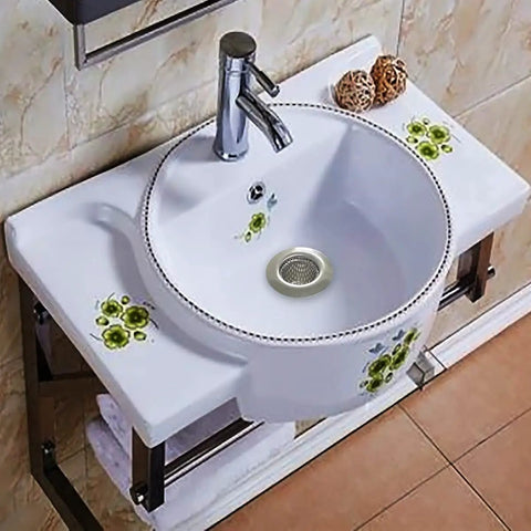 1.25 Inch Drain Strainer Stainless Steel Mesh Basket 2 Pack installed in a modern bathroom sink with floral design.