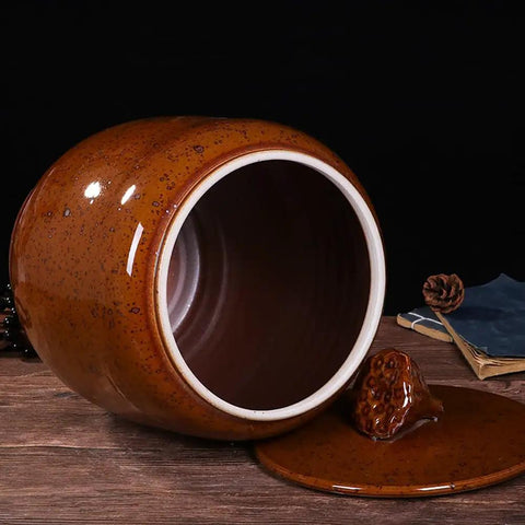 Big Boy Ceramic Rice Jar With Rattle Proof Lid Heavy Duty Porcelain Kitchen Dispenser To Keep Your Grains Coffee Flour And Nuts Fresh Vintage Brown Bulk Pantry Vault showing the inside and lid on a wooden surface.