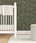 Cozy Cottage Botanical Peel And Stick Wallpaper Removable Linen Texture in a nursery with a white crib and accent rug.