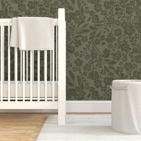 Cozy Cottage Botanical Peel And Stick Wallpaper Removable Linen Texture in a nursery with a white crib and accent rug.