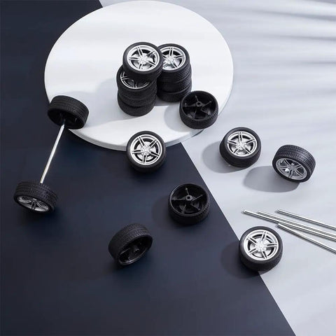 Rad 16 Pack Toy Car Wheels Set With 8 Shaft Axles for RC Cars, showing rubber wheels and metal axles on a table.