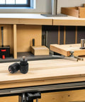 Two Pack Knob Clamping Jig With Spring Mechanism for Computer Chair Swivel Base Tray on woodworking table.