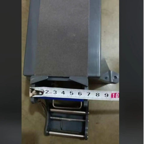 Heavy Duty Tabletop Tape Dispenser With Automatic Carton Sealer Stand showing measuring tape on the base for size reference.