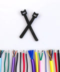 150 Piece Cat Head Cable Management Straps Heavy Duty Nylon Wire Ties on white background with colorful wires.
