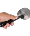 Hand holding stainless steel ice cream spade with no slip grip built to last heavy duty handle BPA free and dishwasher safe easy scoop