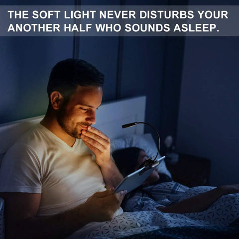Man reading in bed with Amber Rechargeable Book Light With Blue Light Blocking For Night Reading Eye Safe 1600K Warm Glow