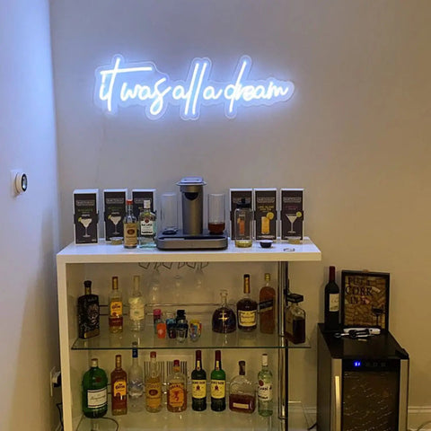 It Was All a Dream Neon Sign Lit Flexible LED Neon Light above home bar with white back plate and bottles