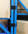 Six Pack 18 Inch By 2 Inch Nylon Heavy Duty Reusable Hook And Loop Cinch Straps securing blue metal poles in a storage room.