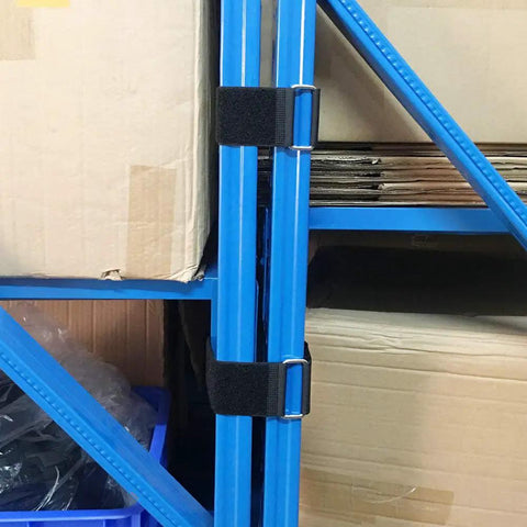 Six Pack 18 Inch By 2 Inch Nylon Heavy Duty Reusable Hook And Loop Cinch Straps securing blue metal poles in a storage room.