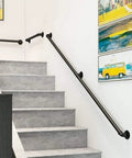 9 Foot Heavy Duty Wrought Iron Handrail For Stairs And Steps Black Metal Grab Bar with Rust Proof Finish mounted on indoor stairs.