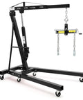 Bad Boy Heavy Duty Folding Hydraulic Engine Hoist And Cherry Picker with chains, designed for lifting up to 2 tons in garages.