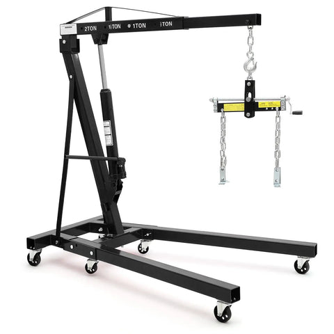Bad Boy Heavy Duty Folding Hydraulic Engine Hoist And Cherry Picker with chains, designed for lifting up to 2 tons in garages.