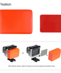 Orange floaty backdoor shown with adhesive stickers for 2 Pack Floaty Backdoor For GoPro Hero 5 6 7 Black Official Super Suit Waterproof Housing Case Replacement Durable Sealed Plastic Backdoor For Floating GoPro Housing Durable Seal For Peace Of Mind And Quick Access To Your GoPro