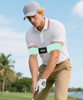 Man using Golf Swing Training Arm Band For Beginners For Men And Boys Swing Alignment Tool For Right Or Left Handed Golfers Corrective Practice Band Easy Fit Standard Large Or Extra Large Keeps Arms And Body In Proper Angle on a golf course.