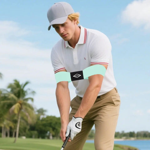 Man using Golf Swing Training Arm Band For Beginners For Men And Boys Swing Alignment Tool For Right Or Left Handed Golfers Corrective Practice Band Easy Fit Standard Large Or Extra Large Keeps Arms And Body In Proper Angle on a golf course.