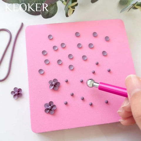 Person using Four Bead Sizes Polymer Clay Bead Roller Kit With Bead Maker And Molds For Clay Crafting on pink surface