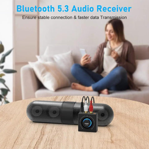 Bluetooth 5.3 Receiver And RCA Audio Adapter For Old School Stereo Stream HiFi Music From Phone Tablet Or Laptop 100 Foot Range 3.5mm AUX Input Dual Link For Two Speakers SBC AAC Compatible on table with couch background