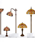 Different Tiffany-style stained glass flower lamps with bronze bases, various heights, including Orange Stained Glass Flower Tiffany Style Table Lamp For Reading Desk And Bedside Use 12 Inch Wide Shade 18 Inch Tall With Antique Green Bronze Base UL Listed Cord Switch Ideal For Bedroom Living Room Or Home Office Decor.