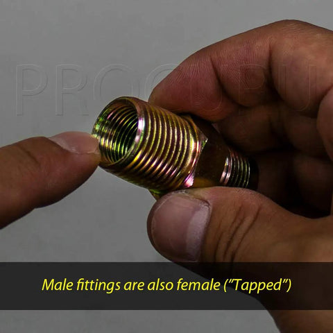 Hands holding a fitting for One Inch Flexible Stainless Steel Gas Connector With Sixty Inch Length Easy Install Three Quarter Inch MIP To Three Quarter Inch FIP Fittings With Or Without Service Valve Heavy Duty WP MaxFlow For Tankless Water Heater Blue A1 Series.