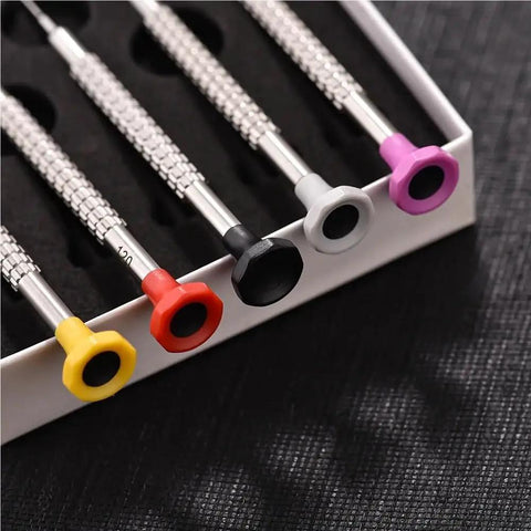 Close-up of Watch Repair Screwdriver Kit with color-coded 3 piece and 1 piece set for movements triangular oscillating weight rotor tools.